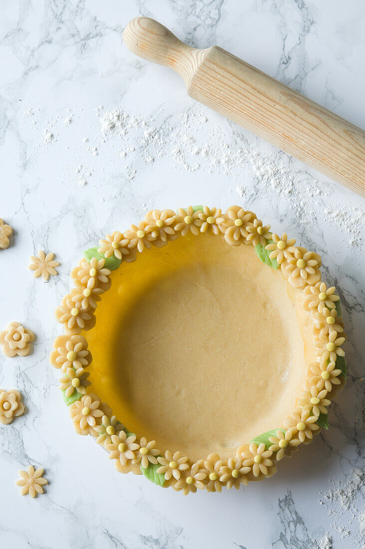 Prepare lemon tart with pastry flower edge