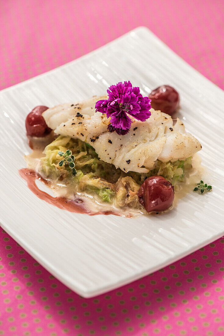 Haddock with summer savoy cabbage and glazed cherries