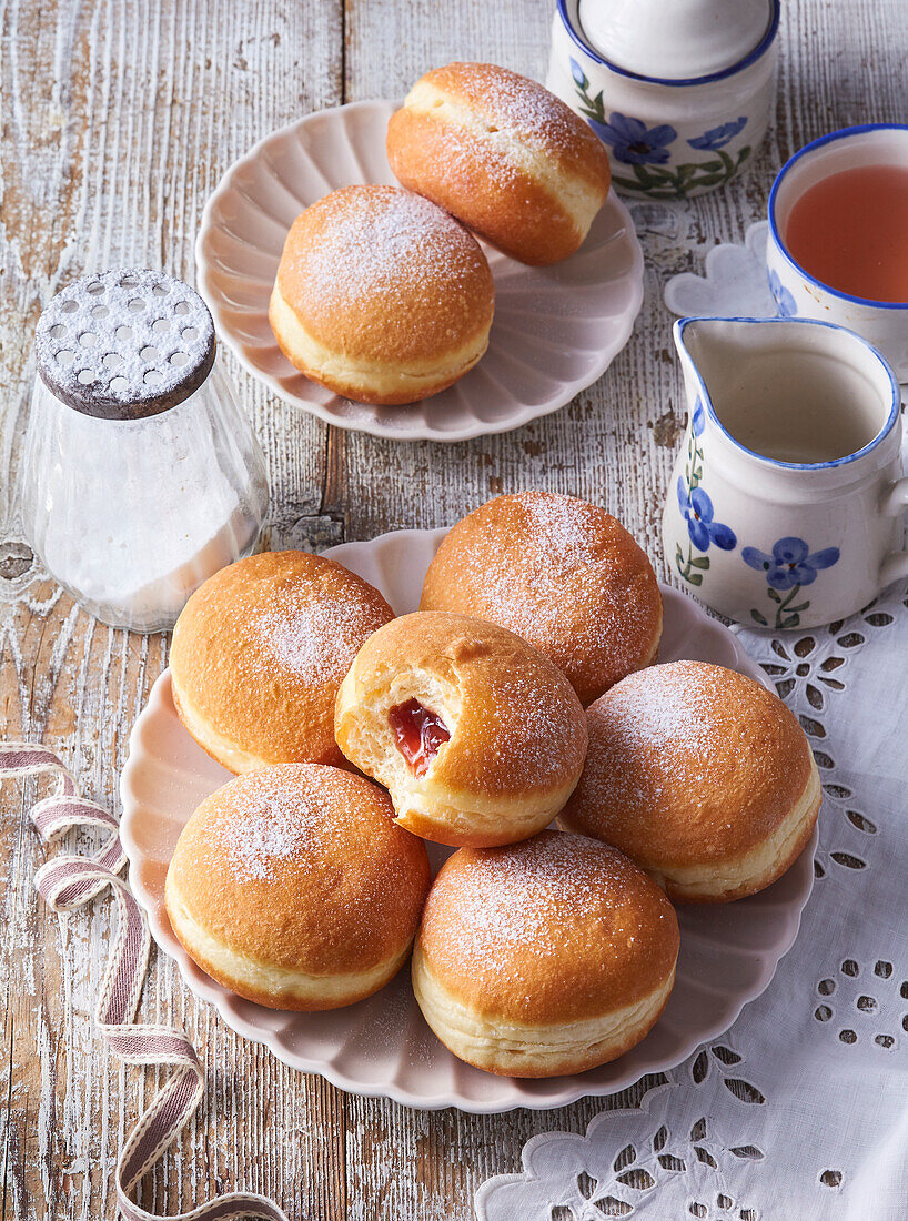 Doughnuts with jam and icing sugar