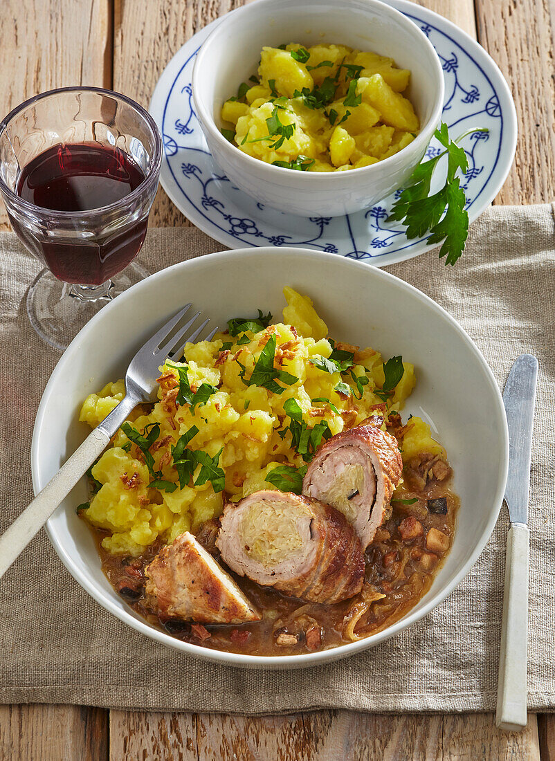 Pork roulades with sauerkraut filling and potato salad