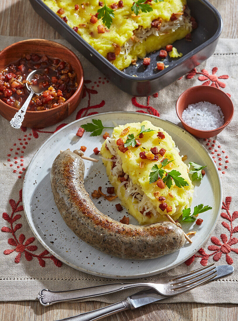 Bratwurst with potato and sauerkraut gratin