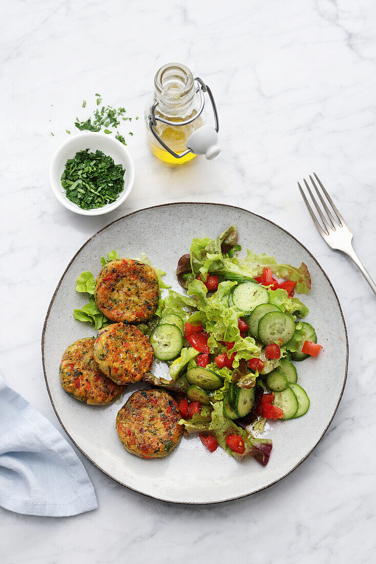 Vegetable pancakes with salad