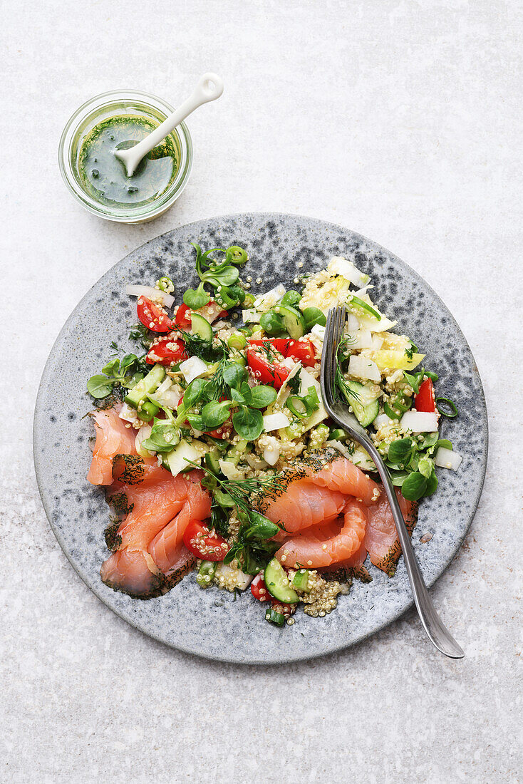 Colourful quinoa salad with smoked salmon and dressing