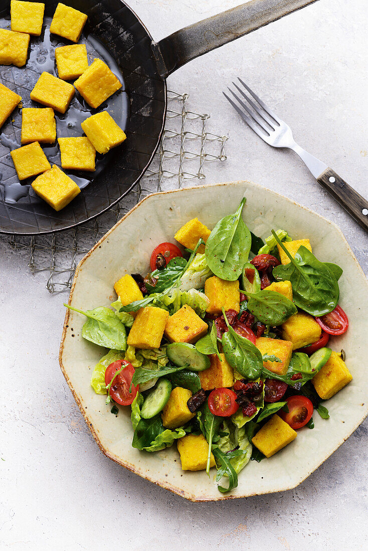 Salad with chickpea croutons and baby spinach