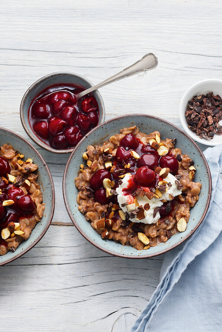 Chocolate and almond porridge with sour cherries and cream