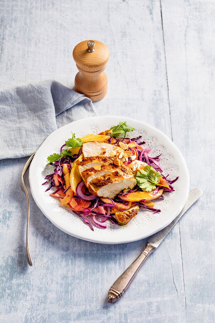 Curried chicken on red cabbage salad