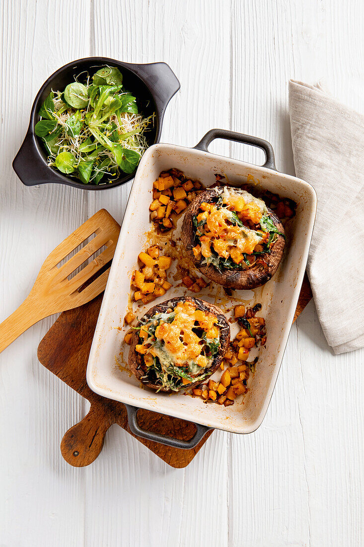 Stuffed portobello mushrooms with cheese and salad