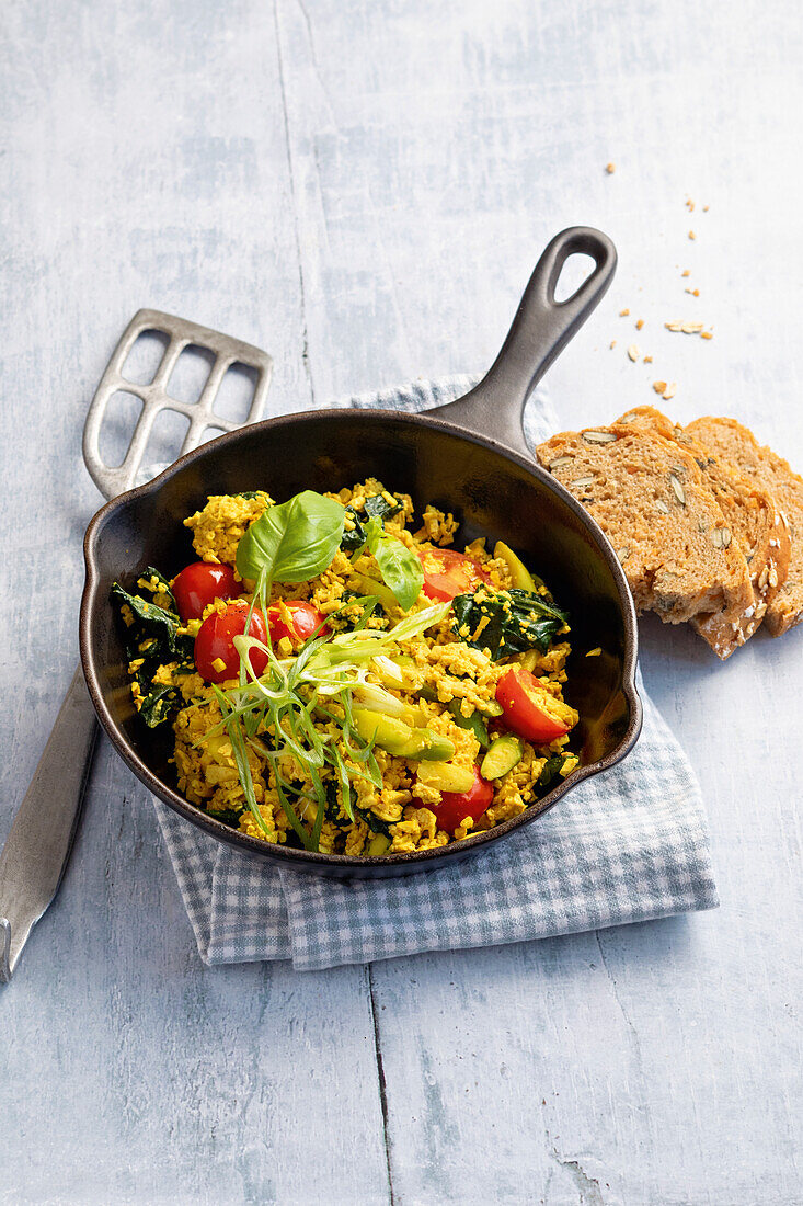 Tofu scrambled eggs with vegetables and herbs