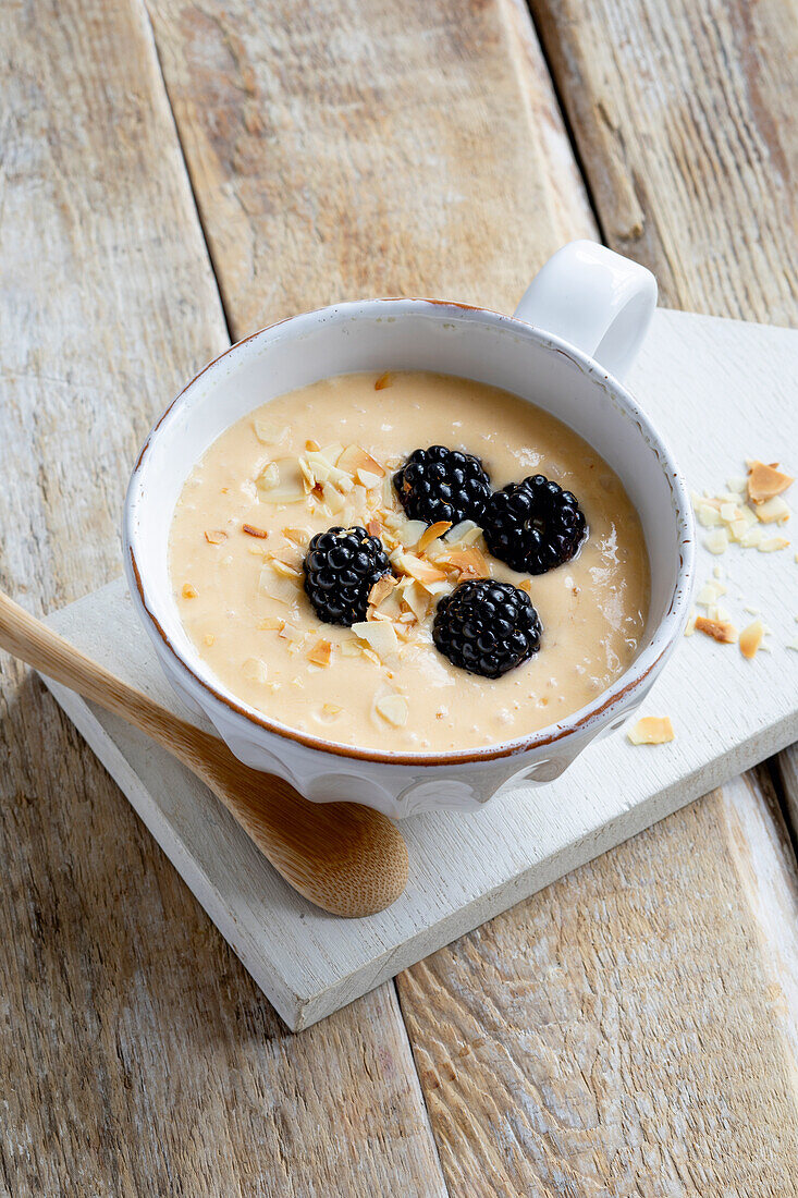 Sea buckthorn cold bowl with blackberries and almonds