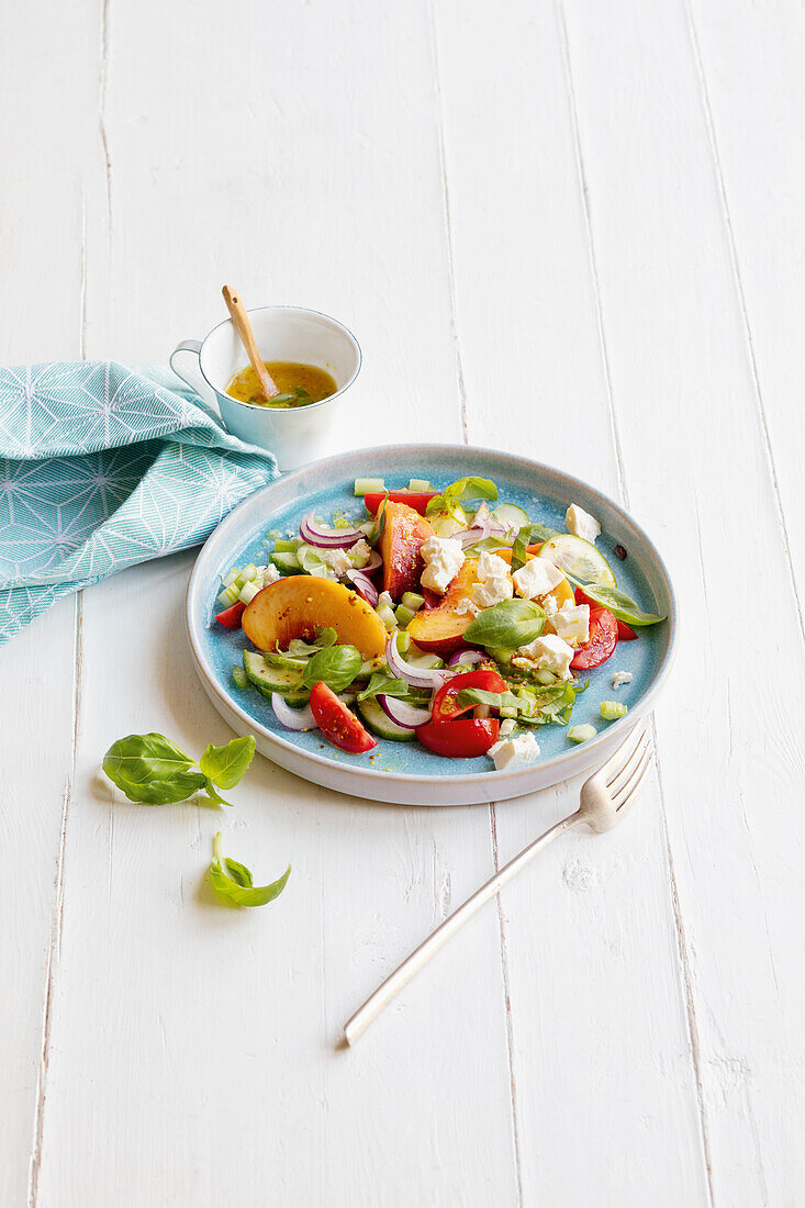 Summer salad with peach and feta