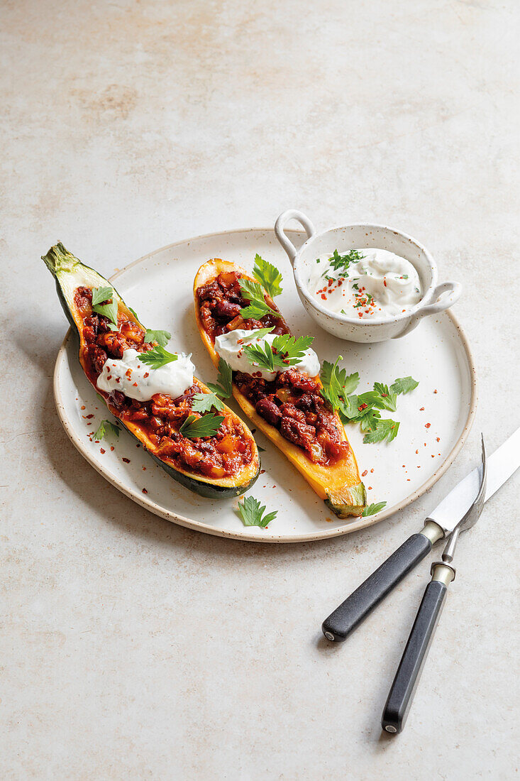 Stuffed courgette boats with yoghurt dip