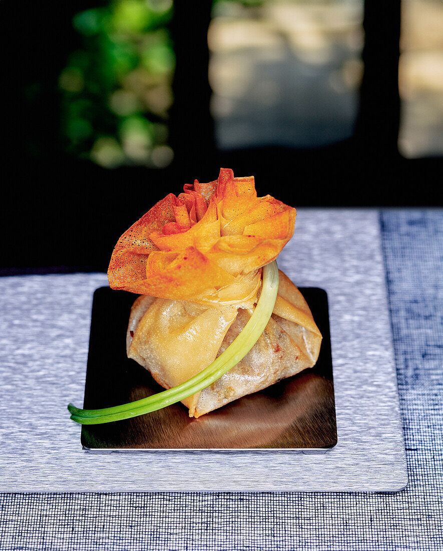 Brick pastry aumônière with lamb filling