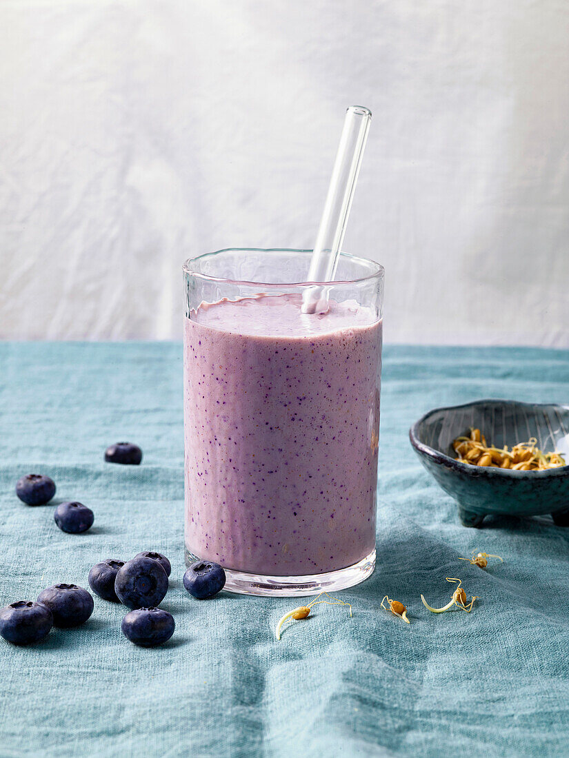 Power breakfast smoothie with blueberries and sprouts