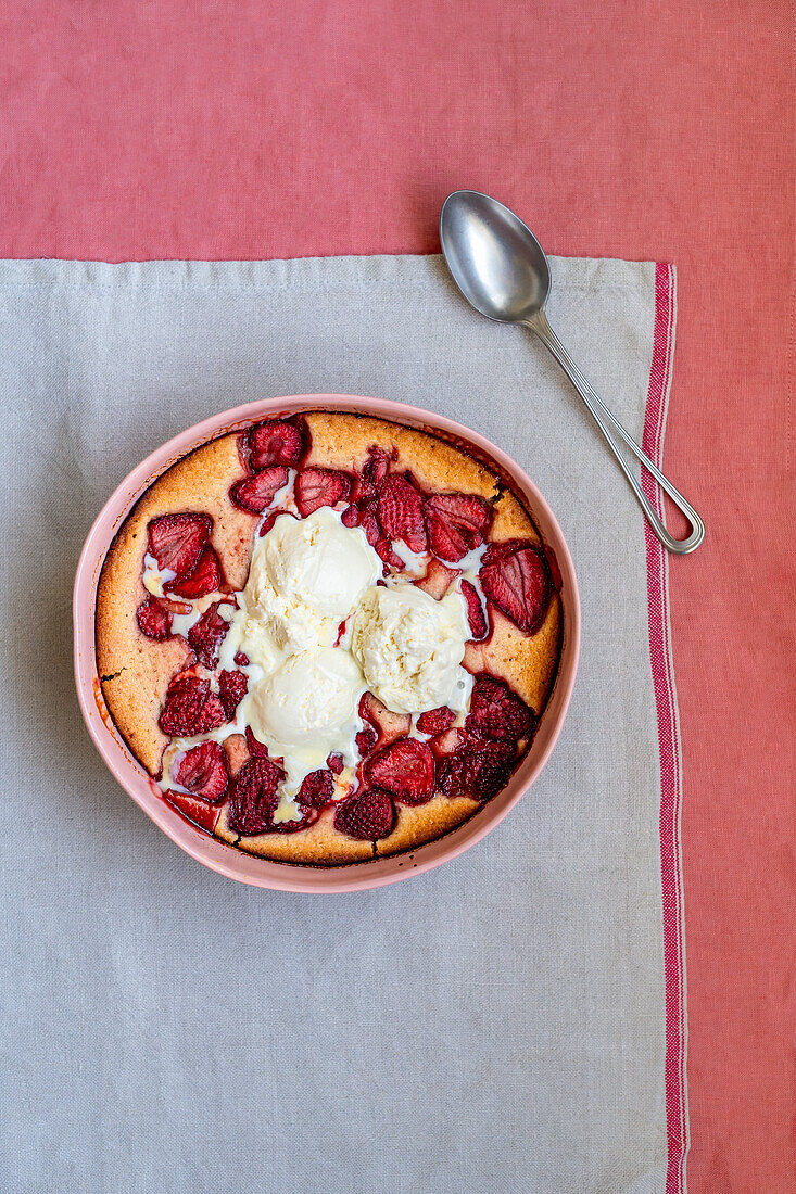 Baked strawberry casserole with vanilla ice cream