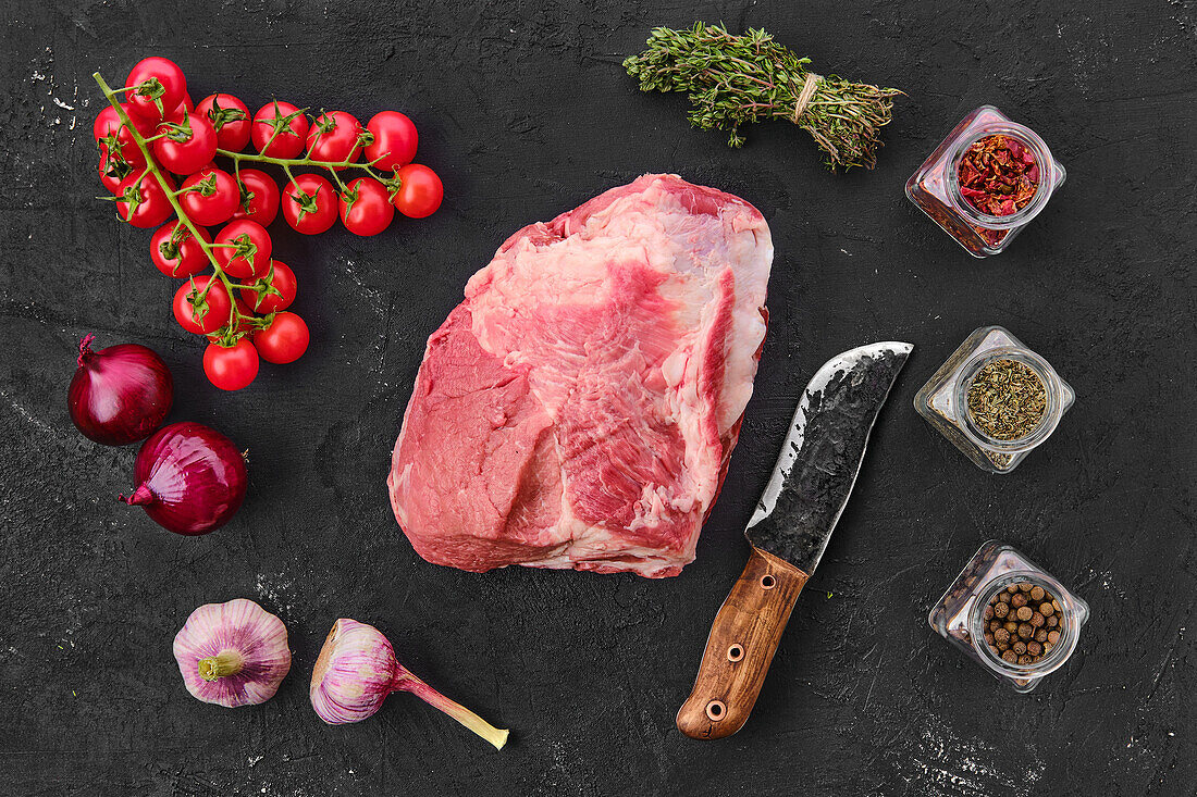 Raw pork shoulder with spices and herbs