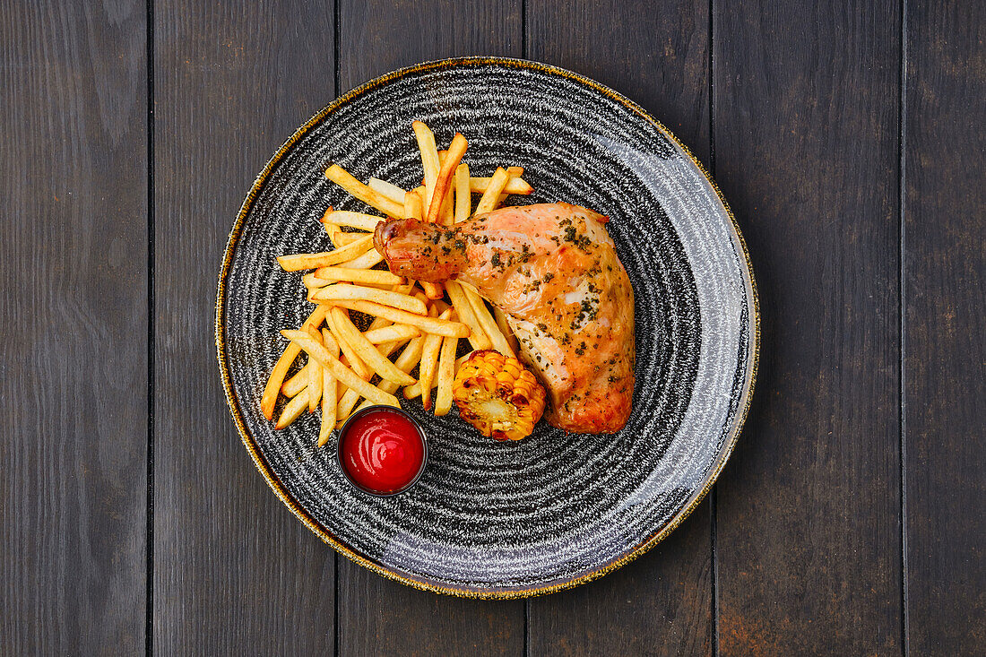 Baked chicken with chips and grilled sweetcorn