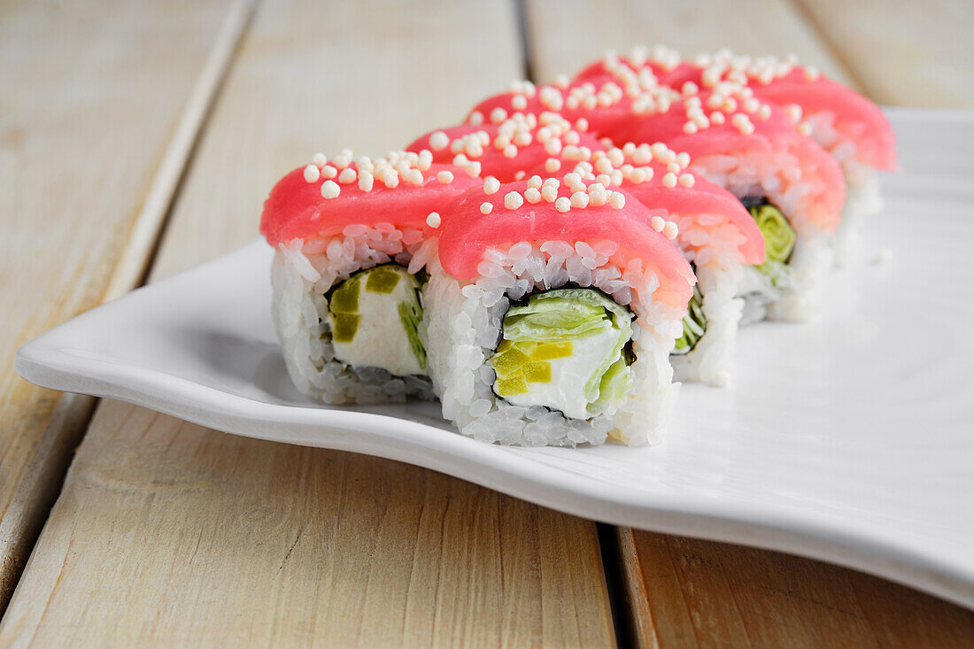 Sushi roll with tuna, cucumber and cream cheese