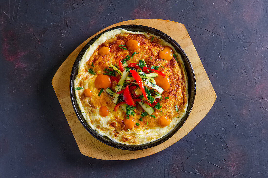 Vegetarian omelette with vegetables in a pan