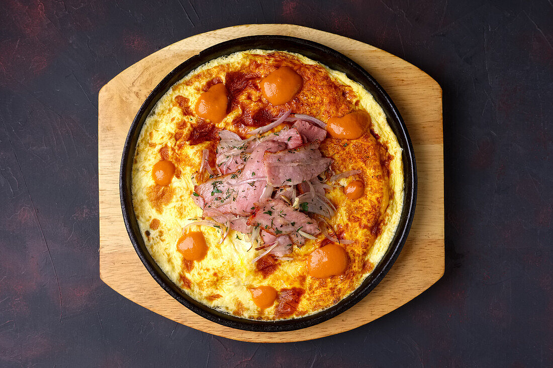 Omelette with bacon and fried onions