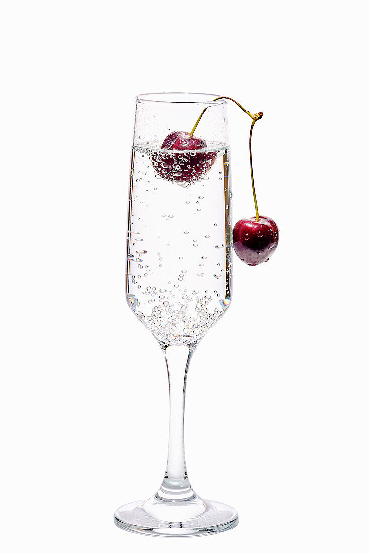 Gin and tonic with cherry garnish