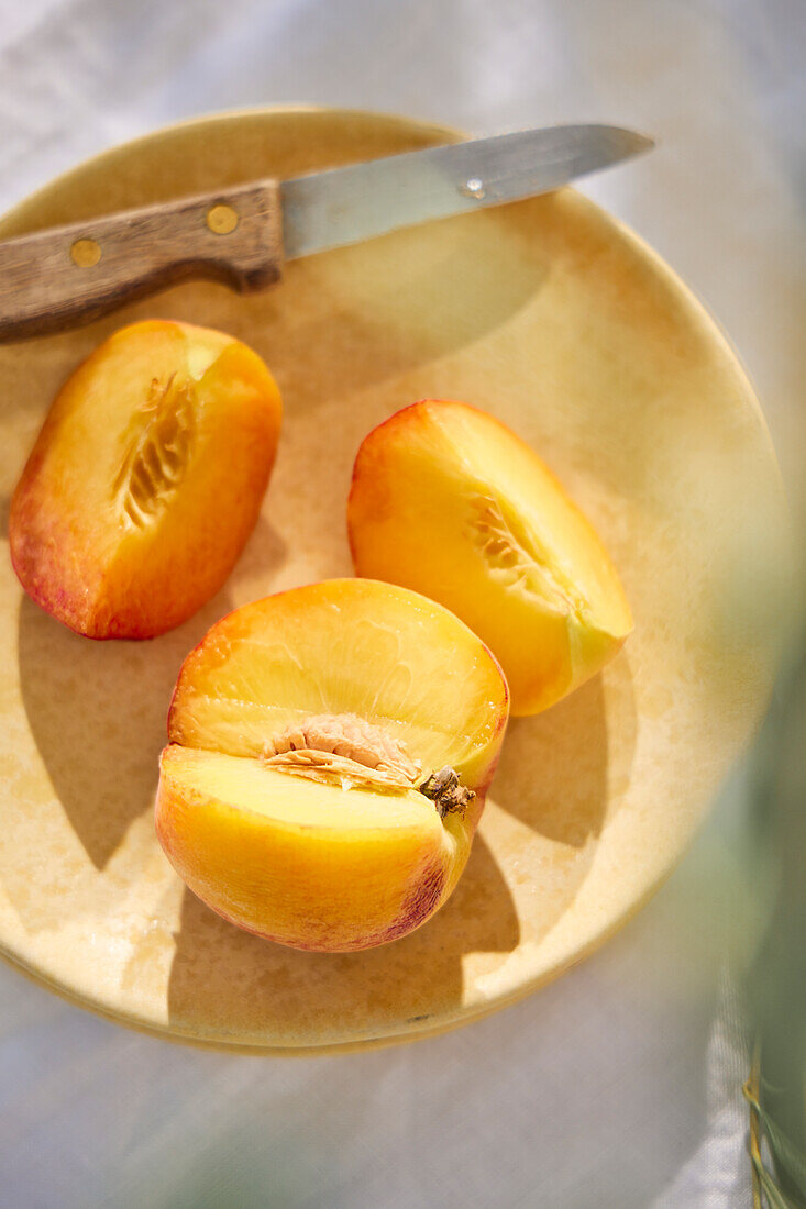 Sliced peach on a plate