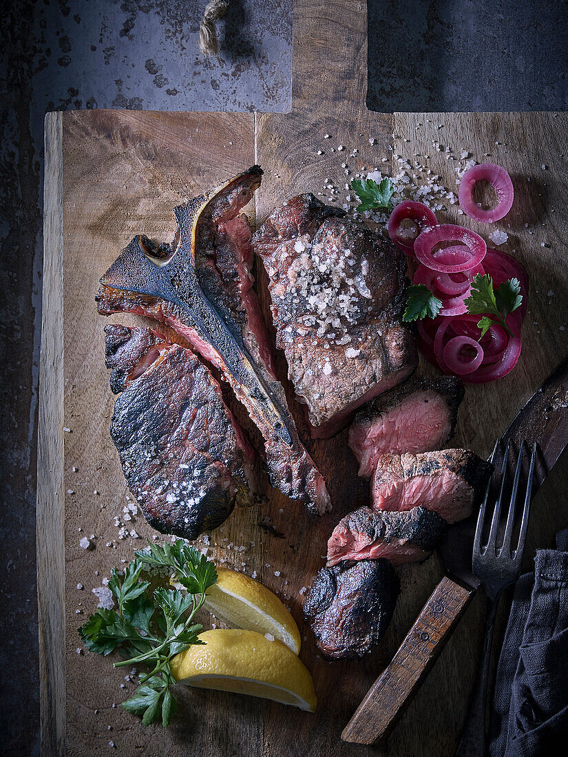 T-bone steak with pickled onions