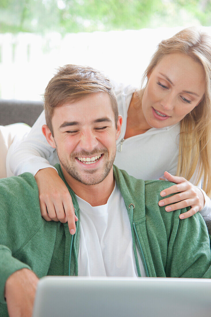 Couple on Sofa Using Laptop