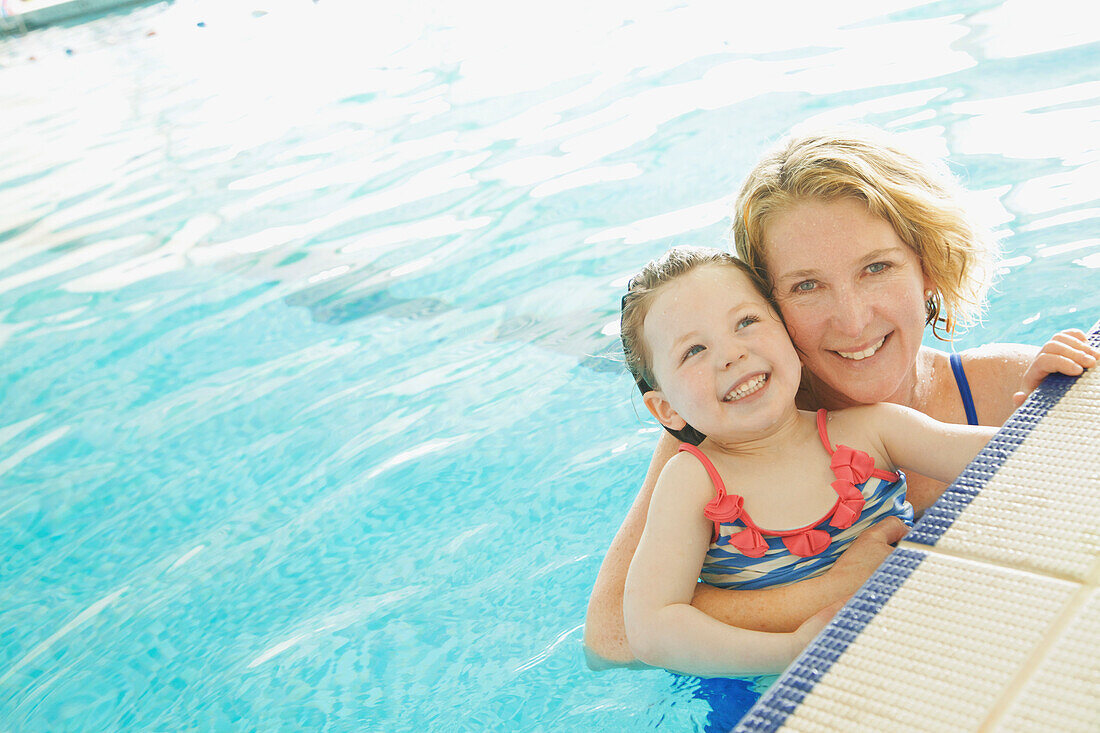 Mother and Daughter in Indoor Swimming Pool