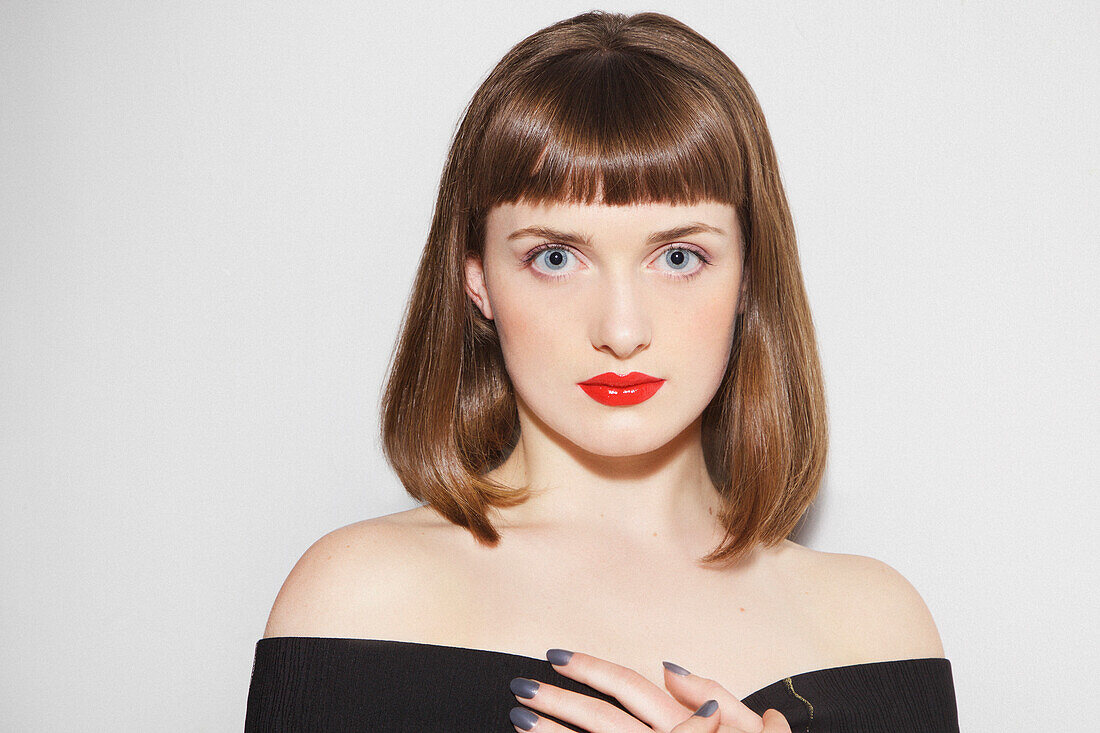 Close up of Young Woman with Red Lips and Bobbed Hair