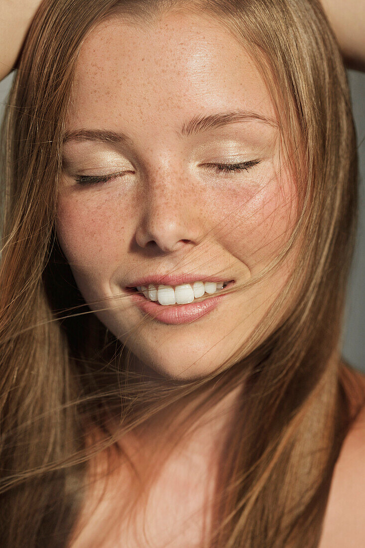 Smiling Young Woman with Eyes Closed, Close-up view