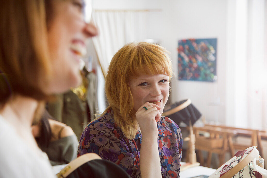 Smiling Female Employee at Embroidery Design Studio