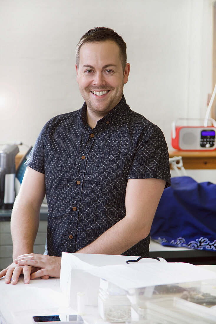 Portrait of Male Employee at Embroidery Design Studio