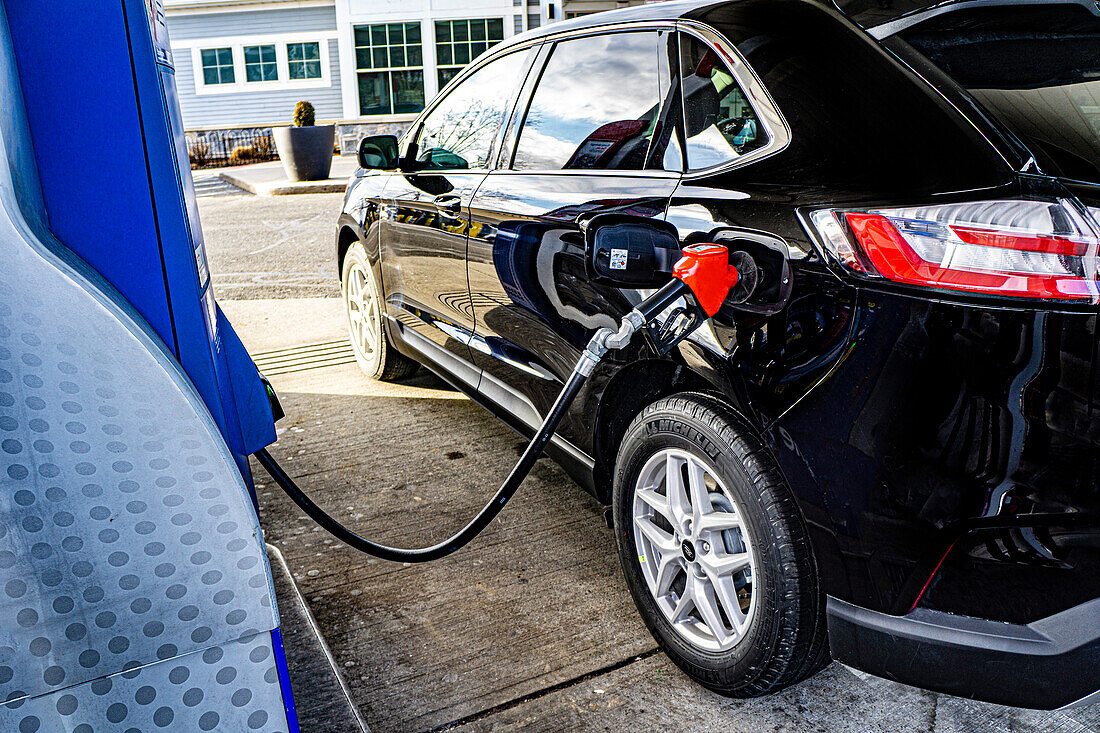 Car refueling at gasoline pump