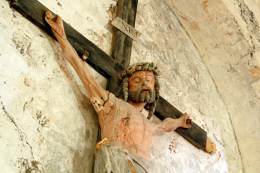 Seine et Marne. Saint Loup de Naud. Church Saint Loup,masterpiece of Romanesque art. Christ on the cross.