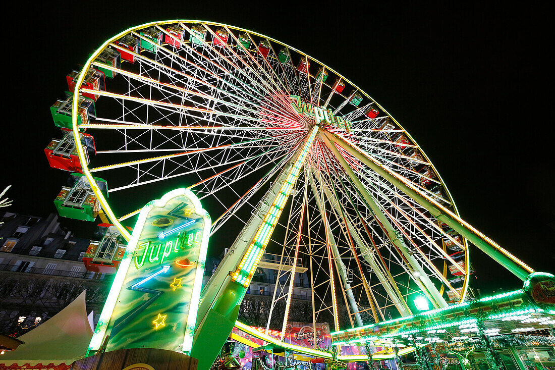 Paris. 1st district. The Tuileries Garden by night. Fun fair at the end of the year. The great wheel. Manege.