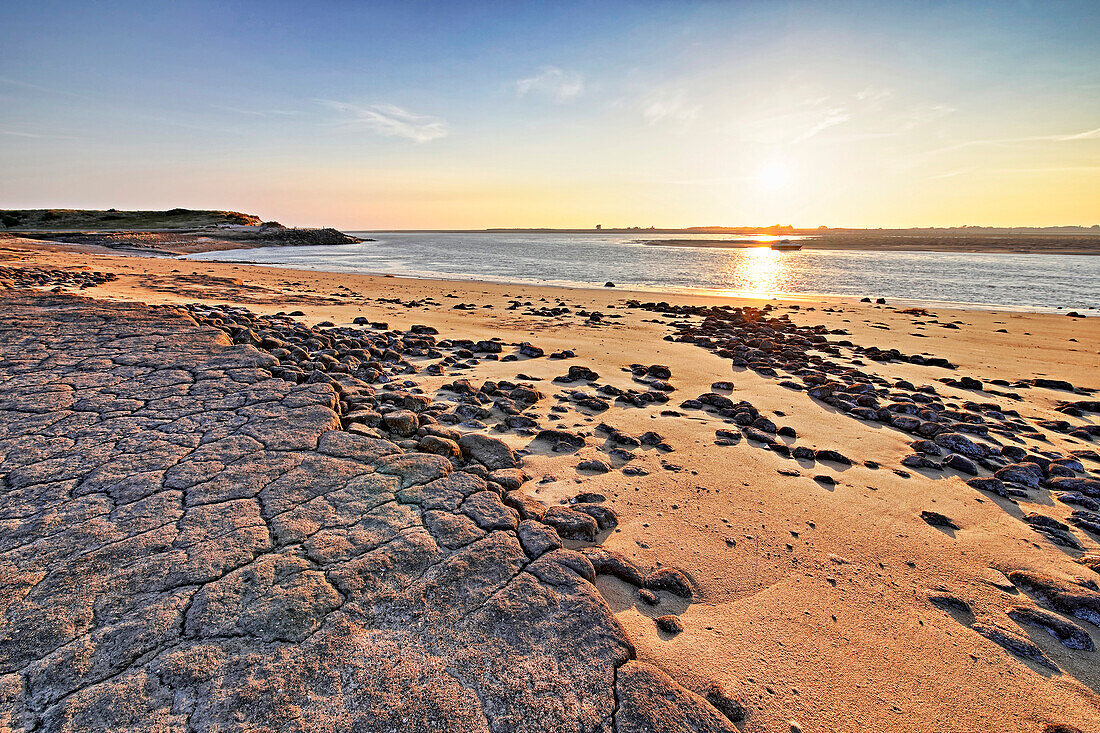 France. La Manche. Montmartin sur Mer,haven of Regneville sur Mer. Sunset. Area of erosion of beaches and dunes due to tides.