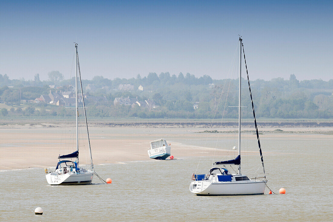 France. La Manche. Havre de Regneville sur Mer. Sailboats at low tide during the spring holidays.