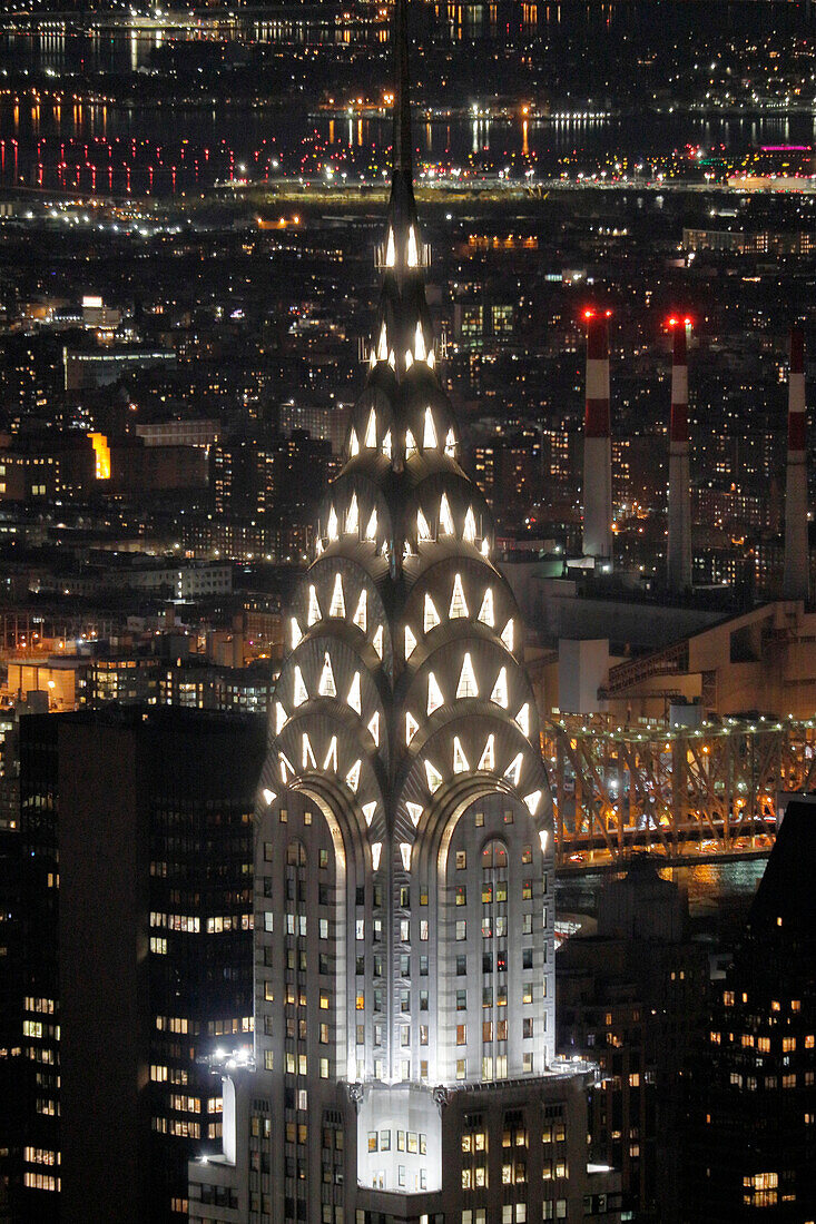 USA. New York City. Manhattan. Empire State Building. View from the top of the building at dusk and night. View of the Chrysler Building and the north east of midtown Manhattan.