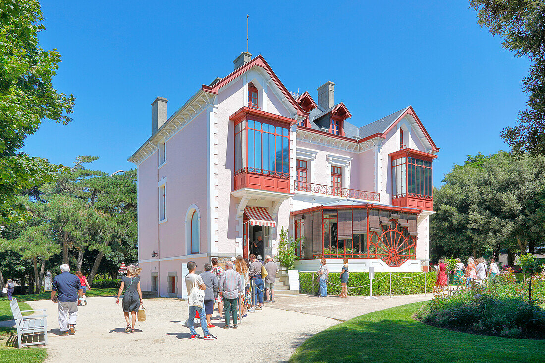 France. Normandy. Department of Manche. Granville. Christian Dior Museum during the summer. Tourists waiting at the entrance.