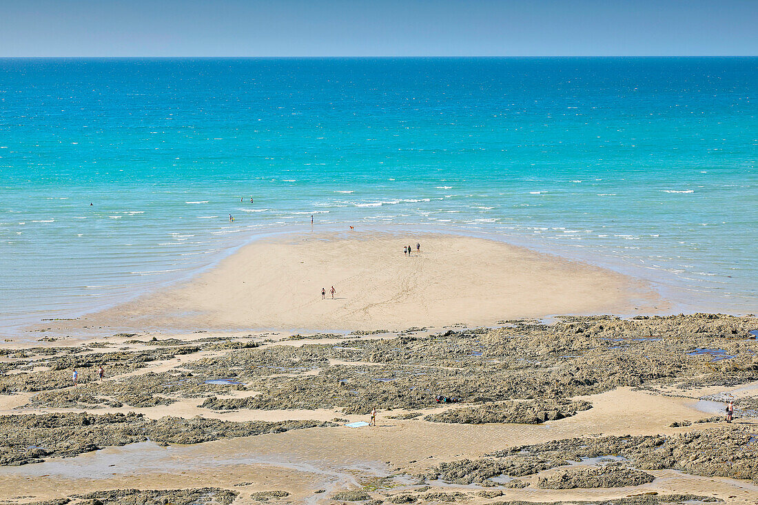 France. Normandy. Department of Manche. Granville during the summer. View of the beach from the upper town. Tourists walking around.