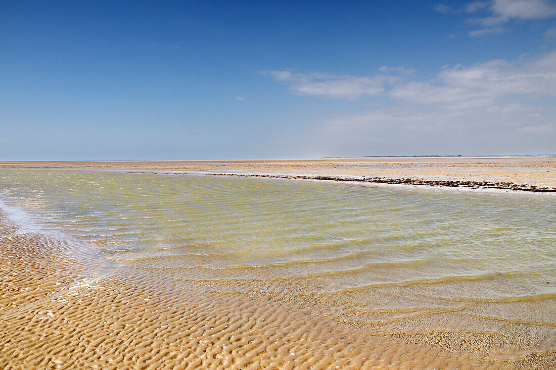 France. Normandy. Department of Manche. Hauteville sur Mer at low tide during the summer. High tide.