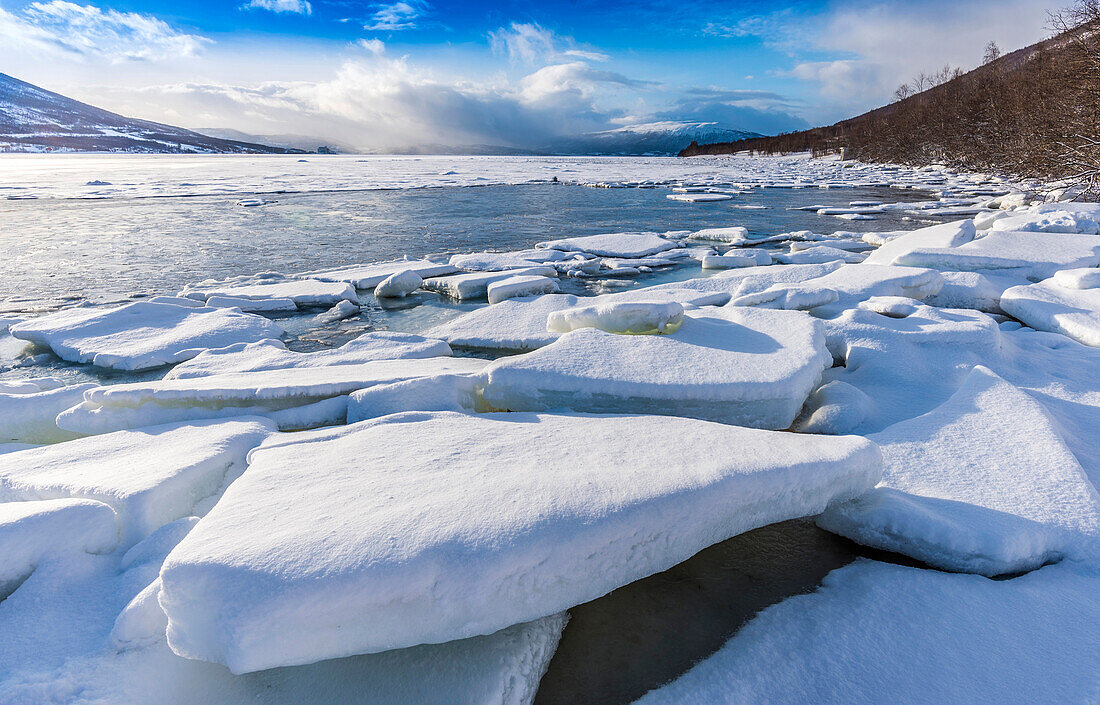 Norway,city of Tromso,Island of Senja,block of ice on the side of a fjord