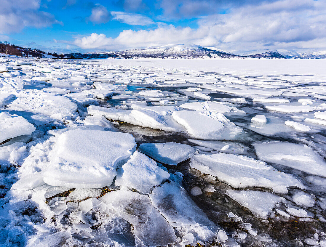 Norway,city of Tromso,Island of Senja,block of ice on the side of a fjord