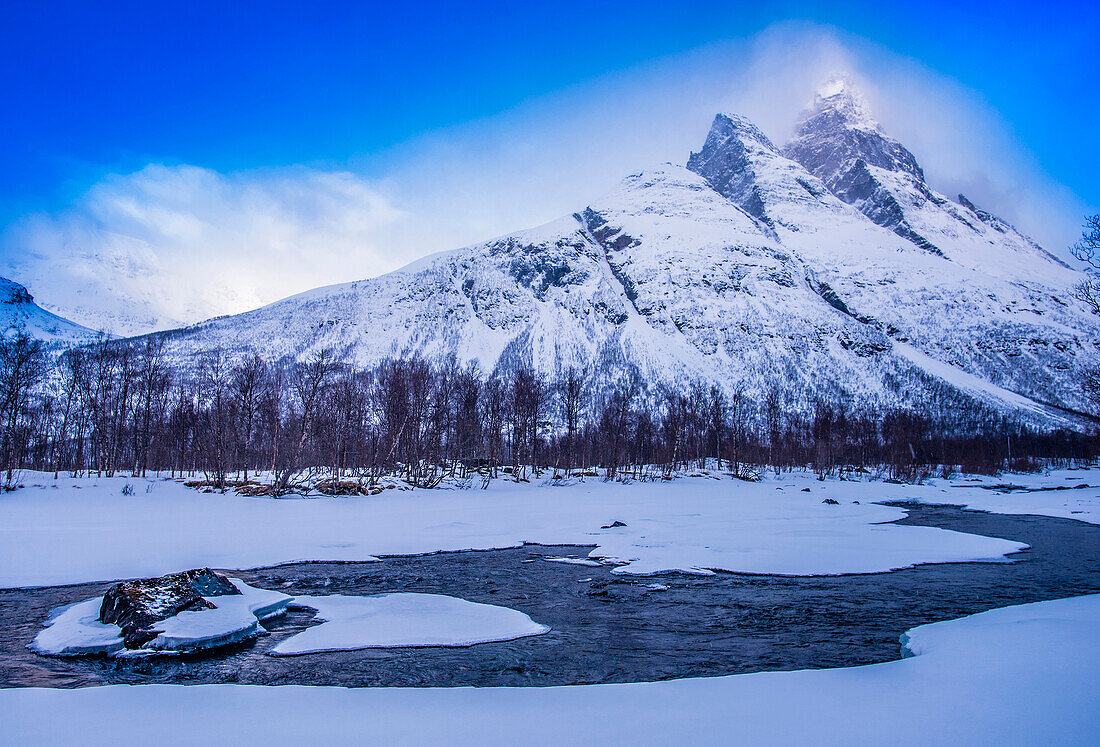 Norway,city of Tromso,Island of Senja,snowy landscape at sunrise