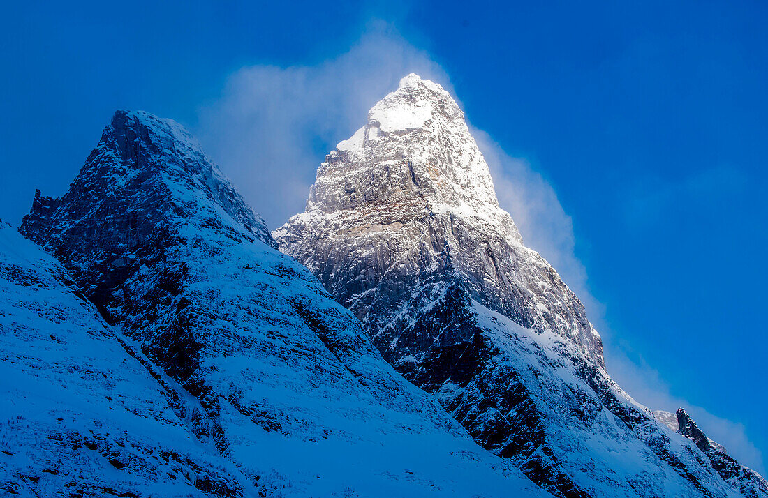 Norway,city of Tromso,sunrise on a mountain peak covered with snow