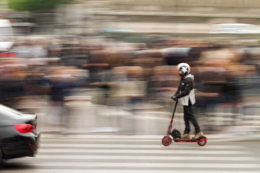 France,Paris,75,4th arrondissement,Quai de l'Hotel de ville,young man on a scooter