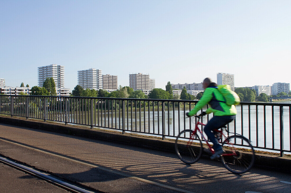 France,Nantes,44,Pirmil bridge,cyclist going to work by bike.