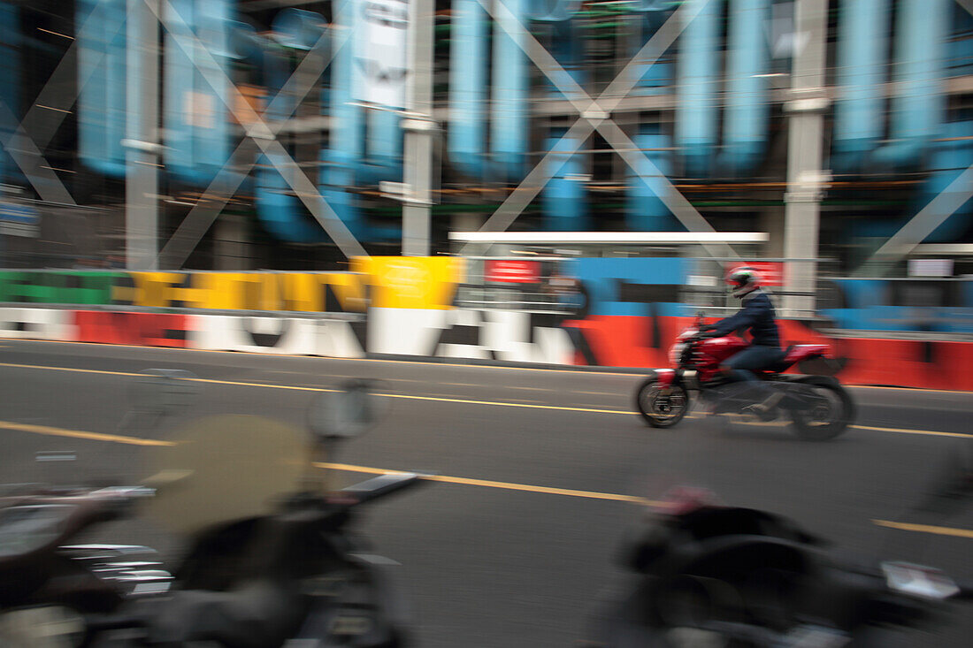 France,Paris,1st district,biker passing at the foot of Centre Georges Pompidou,September 2019.