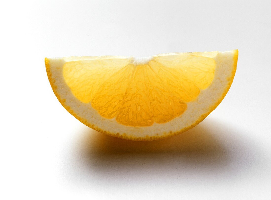 Wedge of a yellow grapefruit