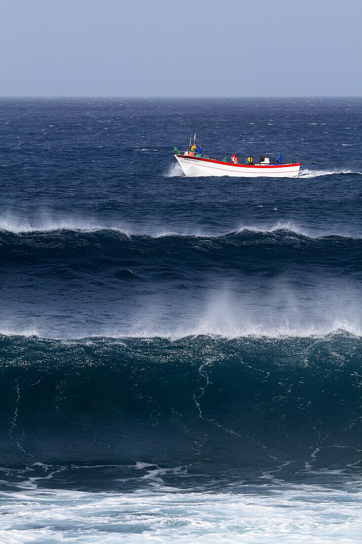 Sao Miguel Island,Azores,Portugal. Ribeira Grande. Wave and fishermen